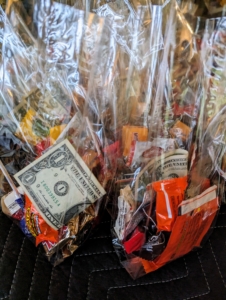 But look, I also added one dollar to each bag. One can also add some pennies - you know, the ones collected in jars and other vessels for that "rainy day." It’s a great way to get rid of all those pennies, while offering something a bit more valuable than candy.