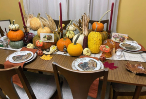 Cassie also says, "I use pumpkins from local nurseries, turkey candy dishes found while thrifting, and postcards from an antique store in Salem, Massachusetts."
