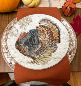 Here is a closer image of Cassie's fun turkey plates. Do you know the history behind turkey patterns? When President Abraham Lincoln proclaimed Thanksgiving official in 1863, English potters began making holiday themed dinner plates and platters to take advantage of the growing market for these pieces. Manufacturers have been producing them ever since.