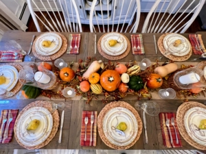 Joey D’Auria "used a variety of squashes and pumpkins to form the centerpiece on this table. Included are acorns, delicatas, and pie pumpkins. I also interspersed butternut squashes and foraged clippings such as bittersweet, astilbe, hydrangea leaves, and dogwood leaves."