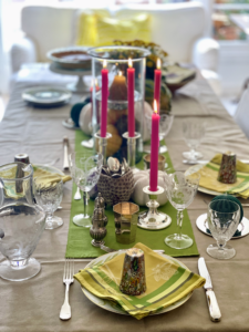 Laryn Callaway-Blok from Phoenix, Arizona writes, "we had an intimate family table for three this year. I wanted it to be extra pretty for my teenage daughter who has been battling a cold. We set the table with more traditional tones of yellow, green, silver and taupe, then added in a mix of crystal and hot pink candles. Even if you’re only three people, it can still feel like a special celebration! (Photo by husband @ChristiaanBlok)