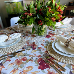 Logan Lewis sent in these two photos. He says, "we dove in, and when we came up for air, I realized I hadn’t taken any other photos, but that’s how you know you had a good dinner party! The table setting is just my favorite fall table every year. I used an old Versace by Rosenthal ice bucket for simple flowers, grabbed a few reflective tea light holders from around the house to light the table, and served everything but the salads off of the buffet."