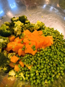 I used about four bags of frozen peas. Green peas are a good source of the B vitamin Thiamin, phosphorous, and potassium. Don’t overcook them – they only take a couple of minutes. Here, they are mixed in with the broccoli and chunks of the last pumpkin we grew this season.