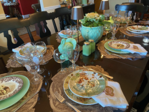 Brian also sent this photo. "In the dining room of my mother’s home we had another table set. The dining table was purchased from Martha’s tag sale as were the Karch chairs and Karch bench. We decorated the table with jadeite plates from Mosser as well as some seasonal plates that had pretty green pumpkins on them that paired beautifully with the jadeite. We set a McCoy planter, planted with an ornamental cabbage and reindeer moss in the middle of the table, and flanked it with Zafferano Poldina Pro lamps in Rust from Martha.com as well as two Martha by Mail Jadeite turkeys."