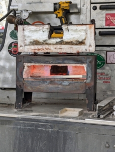 This is a gas forge - one of the most important tools of any farrier. It is used for heating metal and making it more malleable, so it can be shaped into a horseshoe while hot.