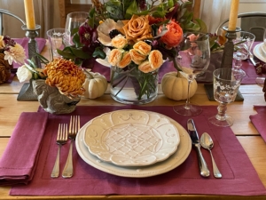 Their centerpiece was made by Amy and Aubry at a floral design class "Made Floral" in Connecticut. Amy adds, "the water glasses are Orrefors, wine glasses are vintage French from Vintageweave in LA, the linens are Sferra, and the plates are Juliska."