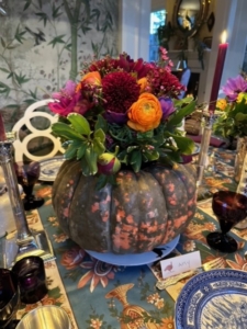 Christopher says, "I used one of the heirloom pumpkins as a center piece for the flowers I arranged, in dark colors, Anemones, dark red peonies and mums and a few orange ranunculus."