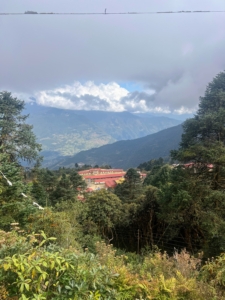 In this photo is the Taksindu Monastery, a Sherpa Buddhist monastery which sits on the cusp of the divide between Solu and Khumbu, Nepal. It is a residential school for 60 monks and nuns and 20 lay people, and is the primary religious institution for the surrounding community.