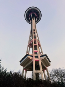 I am sure many of you recognize the Space Needle, the famous observation tower in Seattle. Located in the Lower Queen Anne neighborhood, it was built in the Seattle Center for the 1962 World's Fair, which drew more than two million visitors. The Space Needle stands at 605-feet tall, offers 360-degree views from its three main viewing areas – an indoor observation deck and open-air viewing area located at 520-feet, and an observation level featuring a revolving glass floor located 500-feet above ground.
