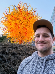 And here is Ryan in front of the giant yellow sun, made from thousands of radiant orange and yellow tubes of glass. What a great visit, Ryan. Thanks for sharing your photos. And please visit Chihuly Garden and Glass the next time you are in Seattle, Washington.