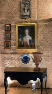 Here, I was looking at both the woven mats on the wall used as the backdrop behind the paintings and the table - its apron has such an interesting shape.