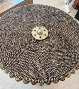In another store, I saw this old 19th century tilt-top table completely covered with shells. It reminded me of my granddaughter, Jude, who loves shells and has a large collection of her own.
