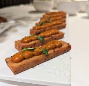 This is chickpea panisse with smoked espelette peppers coulis. Panisses, or chickpea flour fries, are a popular street snack from the south of France.