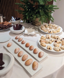 The dessert table was filled with cookies and other sweets.