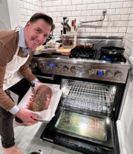 And then on Christmas Day, we put it in the oven. Here's Anthony smiling for a quick photo just before the roast goes in.