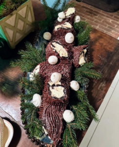 Here is the Bûche de Noël made by Anthony with faux bois chocolate ganache. Christopher made the meringue mushrooms.