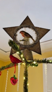 The tree topper is by Wendy Addison, who makes all sorts of wonderful seasonal holiday items - all by hand.