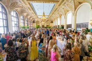 More than 550 guests attended the event and crowded around the auction tables to see all the available handbags.(Photo by Carrie Bradburn/CAPEHART)
