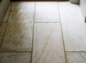 These floors are from a home I once owned in Long Island. They are its old garden pavers. Both the tops and bottoms were so nicely aged - stained from earth and grass, I loved them and had just enough of the timeworn stone slabs to cover my Winter House kitchen and servery floors.