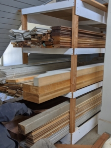 In my stable hayloft, I store various moldings, window casings, etc. All the moldings are kept on these shelves and stacked according to length and type. I keep the moldings stacked horizontally to keep them from bowing.