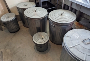 In my generator room, I use these metal garbage bins to store the wild birdseed. Look for storage solutions that are durable and long-lasting. These receptacles are inexpensive and easy to find at hardware stores and home improvement shops.