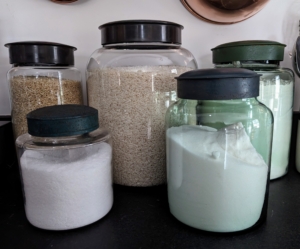 Storage solutions can be both functional and pretty. Here in my studio kitchen, we keep lots of flour, sugar, and grain in these large glass containers. Pantry vessels like these are so useful for so many items and can be kept on the countertop for easy access.