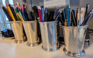 On my kitchen desk, old silver plated julep cups serve as pen and pencil holders - so pretty in any office space.