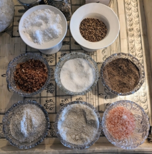 I use a variety of small dipping bowls and salt cellars to store different types of salt where I can reach them easily.