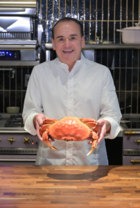 Here is Chef holding a large Alaska dungeness crab. (Photo by John Labbe, smugmug.com)
