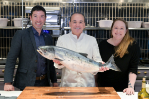 Here is a photo of Chef Jean-Georges, third-generation Alaska Fisherman Hannah Heimbuch, and Greg Smith with Alaska Seafood Marketing Institute. Chef is holding a a whole Alaska salmon. (Photo by John Labbe, smugmug.com)