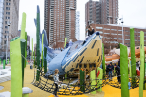 And this is the new Pier 26 Science Playground which features custom-made play structures in the shape of two endangered sturgeon species native to the Hudson River — the Atlantic sturgeon and shortnose sturgeon. (Photo courtesy of HudsonRiverPark.org)