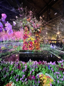 It was the Flower Show's largest body of water ever created. The colorful aerial blooms above reflect in the glass-like water below.