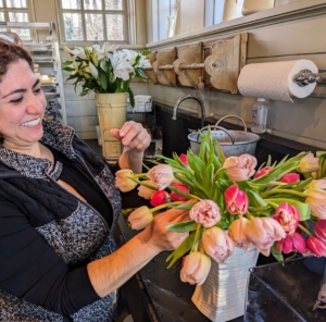 Here, Enma finishes up a tulip arrangement. Tulip colors can be mixed depending on preference. Tulips have been hybridized in just about every color except blue.