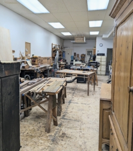 Walking through the door, one enters a real workshop with many stations and many pieces in some stage of restoration.