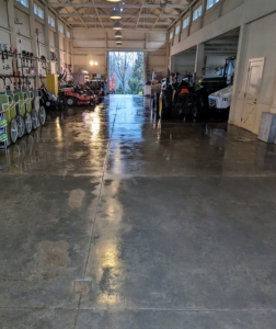 The floors are blown, power washed, and left bare to dry for several hours.