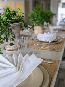 The event was a casual, small intimate gathering, so I decided to have it at my kitchen counter. Beautiful houseplants were brought in from my greenhouse. My housekeepers and I work on the table settings together. We try to make each one different and pretty.