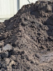 This is organic compost. I like to top dress my beds with this in the spring to add nutrients, such as nitrogen, into the soil. Compost is an efficient and practical fertilizer. Adding compost also improves the soil's ability to absorb and store water, aerate, and increase the activity of organisms.