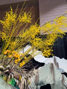 These yellow cut branches are Oncidium, also known as dancing lady orchids.