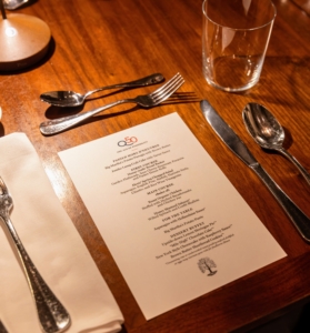 At each table setting, we place a menu of all the foods to be served. (Photo by Gaby Duong)