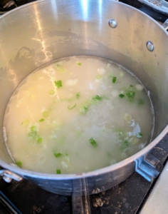 Two cups of water are added once the rice turns chalky-white. The rice is brought to a boil and then left to simmer until tender.
