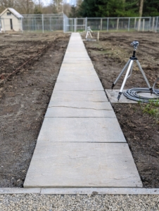 I am so pleased with how it looks. This is the full length of the new footpath. The twine farthest left and right marks where the peonies are planted. There are also three hose bibs in this garden for watering.