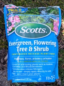 We use Scotts Evergreen, Flowering Tree & Shrub fertilizer - an 11-7-7 formula that's great for evergreens and many other acid-loving trees and shrubs.