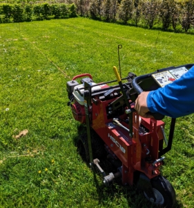 The next step is to remove the sod from the designated area. This is done with our Classen Pro HSC18 sod cutter. This sod cutter is so easy to maneuver and so sharp, Chhiring finishes one row in just minutes.