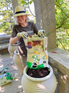 Here I am adding nutrient-rich potting soil to the pot. This great mix is from Scotts Miracle-Gro.
