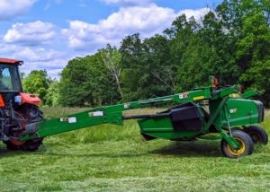 This equipment also works to remove the waxy coat on the crop as it conditions, making the hay dry faster – this means less waiting time and less chance for poor weather to negatively impact the hay quality. When weather conditions are ideal, these machines allow farmers to cut wide and fast – the best formula for quality field productivity. As the mower-conditioner goes over the grass, it cuts it and then conditions it – all under the protective hood of the machine.