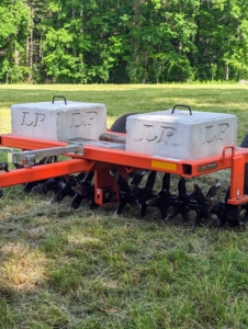 Weights are used on the aerator to help maintain even piercing in the soil.