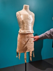 By the 1920s, undergarments became less bulky and less heavy, but still maintained shaping qualities such as a stomach flattening girdle and chest suppressing brassiere.