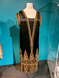 Many evening dresses of this time were decorated with beads, sequins, and rhinestones and were made specifically to stand out, especially on the dance floor.