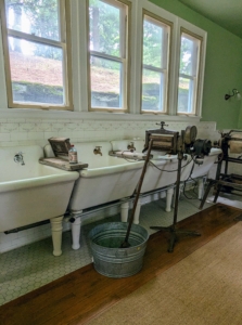 This wall is lined with large, deep sinks for washing delicates.