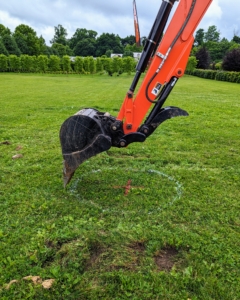 The backhoe is guided so easily and so precisely, so it cuts the soil and digs the hole right where "x" marks the spot.